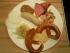 Brotzeit mit Wei&szlig;w&uuml;rstl, Leberk&auml;s, Wurstsalat, Laugenbrezn, Obatzda, Krautsalat und Radi