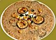 Gr&uuml;nkernsuppe mit Walnusskernen und Champignons
