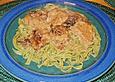 Schweinefilet mit Backpflaumen in Wei&szlig;wein auf gr&uuml;nen Tagliatelle
