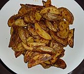 Country - Potatoes oder w&uuml;rzige Kartoffelspalten aus dem Ofen (Bild)