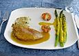 Rotbarbenfilets auf Risottomedaillon und Riesengarnele mit gef&uuml;llten Zucchini an zweierlei Sauce