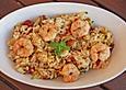 Risotto mit Zucchini, getrockneten Tomaten und Garnelen