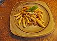 Penne in Tomatensauce mit Speck und K&auml;se