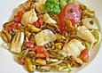 Fischfiletgulasch mit Muschel - Kapern - Sauce auf Pasta
