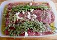 Lammlachse mit Kr&auml;uterkruste auf einer Bohnentrilogie und Kartoffel - Kresse - P&uuml;ree