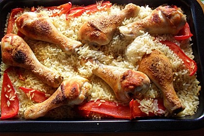 Hähnchenschenkel auf Reis