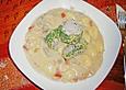 Pochiertes Schweinefilet im Kr&auml;utermantel auf Champignon - Gnocchiragout