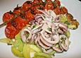 Calamari mit Zucchinigem&uuml;se und geschmorten Tomaten