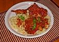 Kaninchen mit Schalotten in Tomatensauce