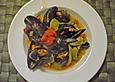 Muscheln mit Wurst und Schinken