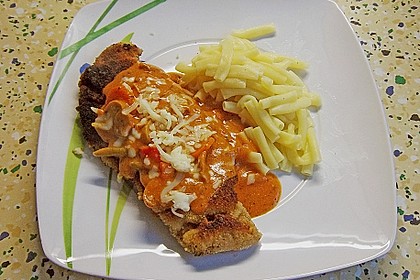 Schweineschnitzel "Mailand" paniert, mit K&auml;se garniert