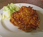 Paniertes Schweineschnitzel mit Kartoffelkruste (Bild)