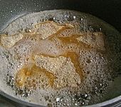 Paniertes Schweineschnitzel mit Kartoffelkruste (Bild)