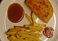 H&auml;hnchen mit Frischk&auml;sef&uuml;llung und selbst gemachten Pommes