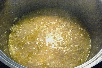 Reispfanne mit Fleisch und Scampi