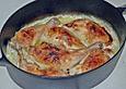 Gebackene H&auml;hnchenkeulen auf Kartoffeln