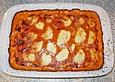 &Uuml;berbackene Putenschnitzel im Gem&uuml;sebett mit Tomaten - Sahne - So&szlig;e