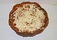 Gef&uuml;llter K&uuml;rbis mit Parmesan und ger&ouml;steten Pinienkernen