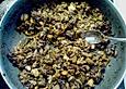 Gebratene Pilze mit Speck und Zwiebeln