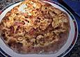 Dinnete mit Zwiebeln und Speck
