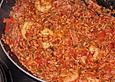 Feuermohns Reispfanne mit Tomaten und Garnelen