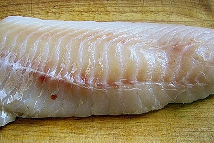 Skreifilet mit Schwarzwurzeln und Schmortomate