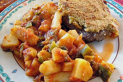Lammsteaks mit Kr&auml;uterkruste auf mediterranem Spargelgem&uuml;se