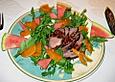 Entenbrust auf Rucola an Melone und Sharonfrucht